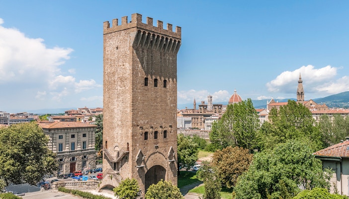 Tower of San Niccolo in Florence with scenic cityscape in the background.