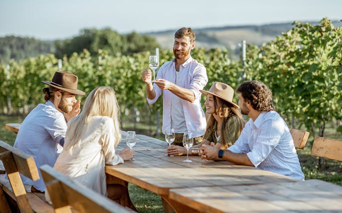 Wine tasting group at vineyard near Barcelona.