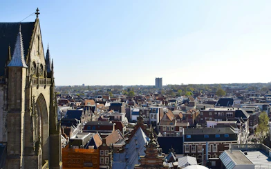 Aerial view of Haarlem rooftops with church spire, part of Beer Tour Haarlem.