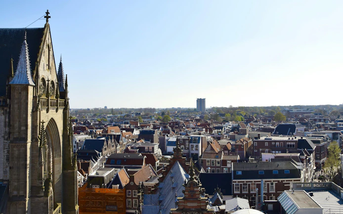 Aerial view of Haarlem rooftops with church spire, part of Beer Tour Haarlem.