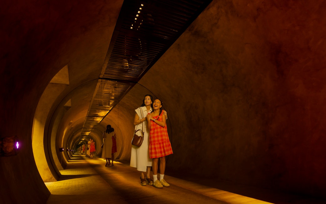 Mother and daughter exploring tunnel at Exploria, Mandai Wildlife.