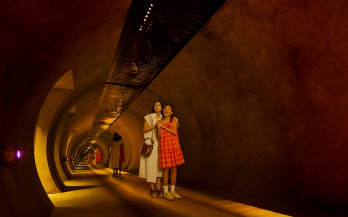 Mother and daughter exploring tunnel at Exploria, Mandai Wildlife.
