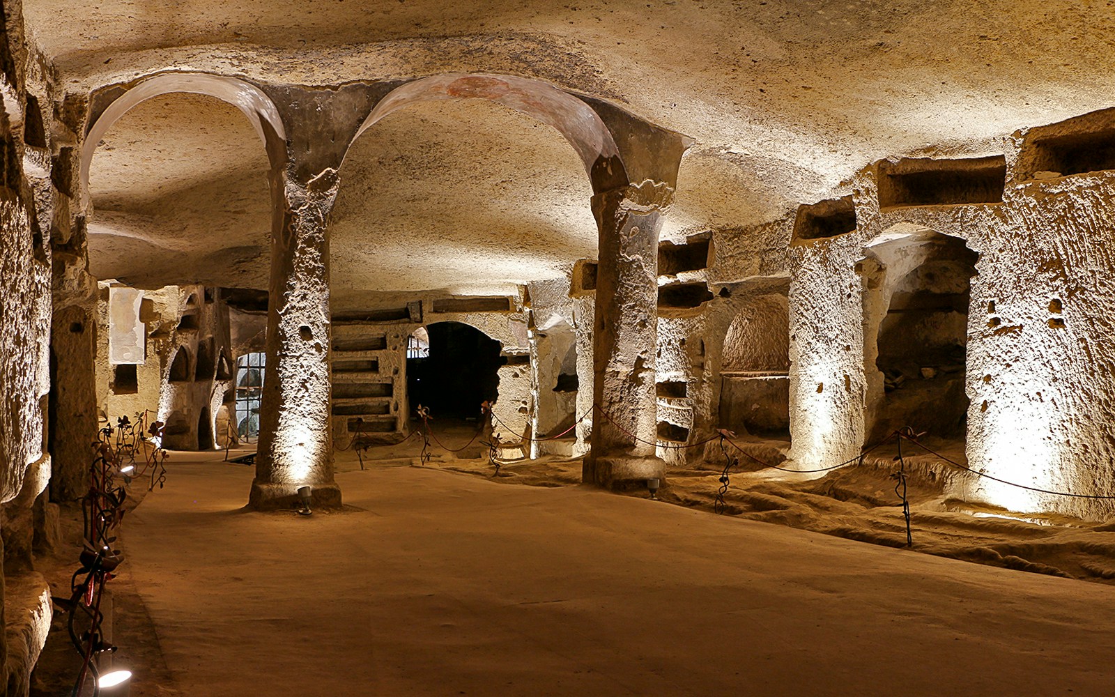 The Lower Catacombs inside Naples' Catacombs of San Gennaro with ancient frescoes and burial sites.