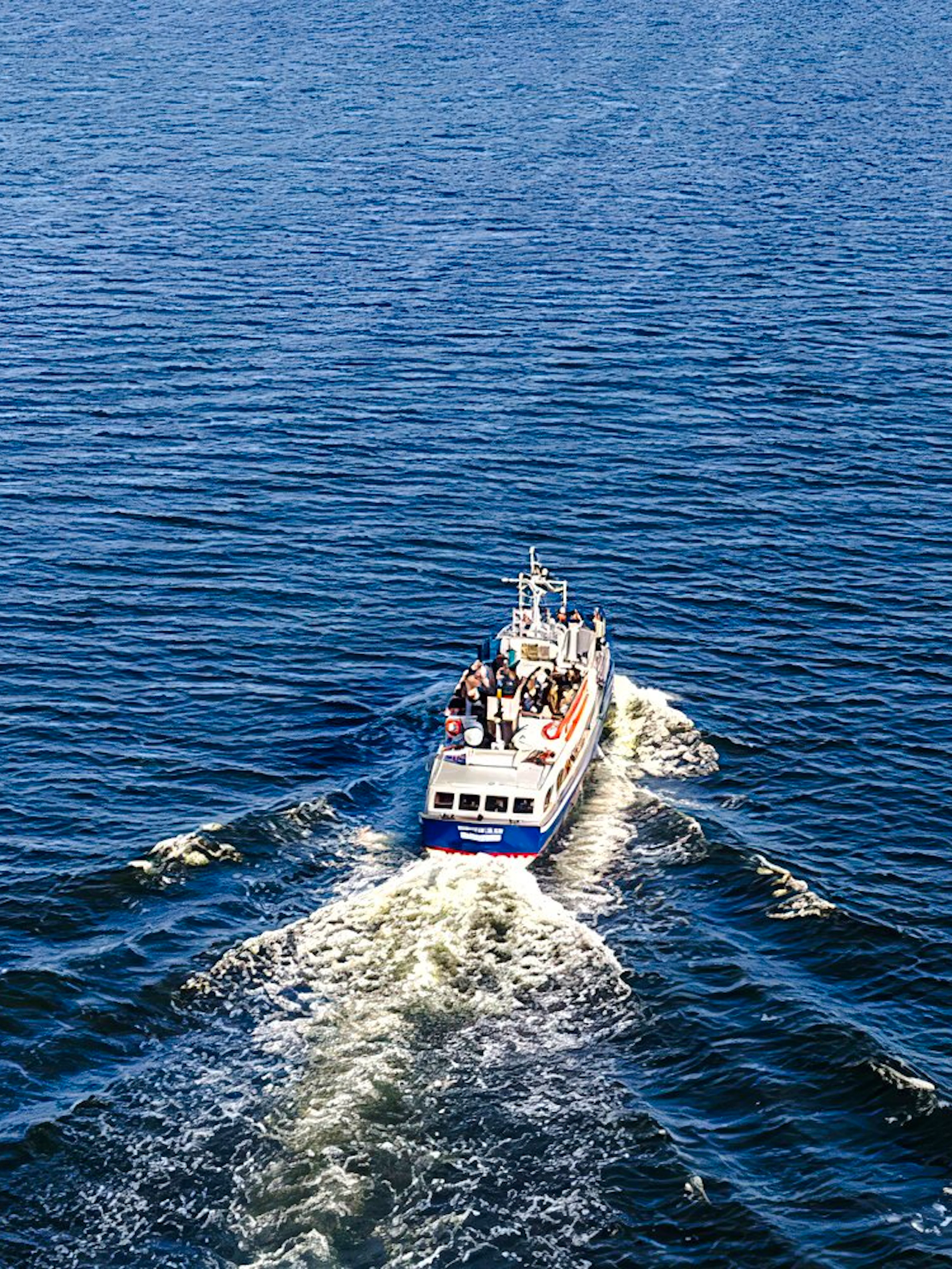 Boat cruising through Stockholm Archipelago waters during tour.
