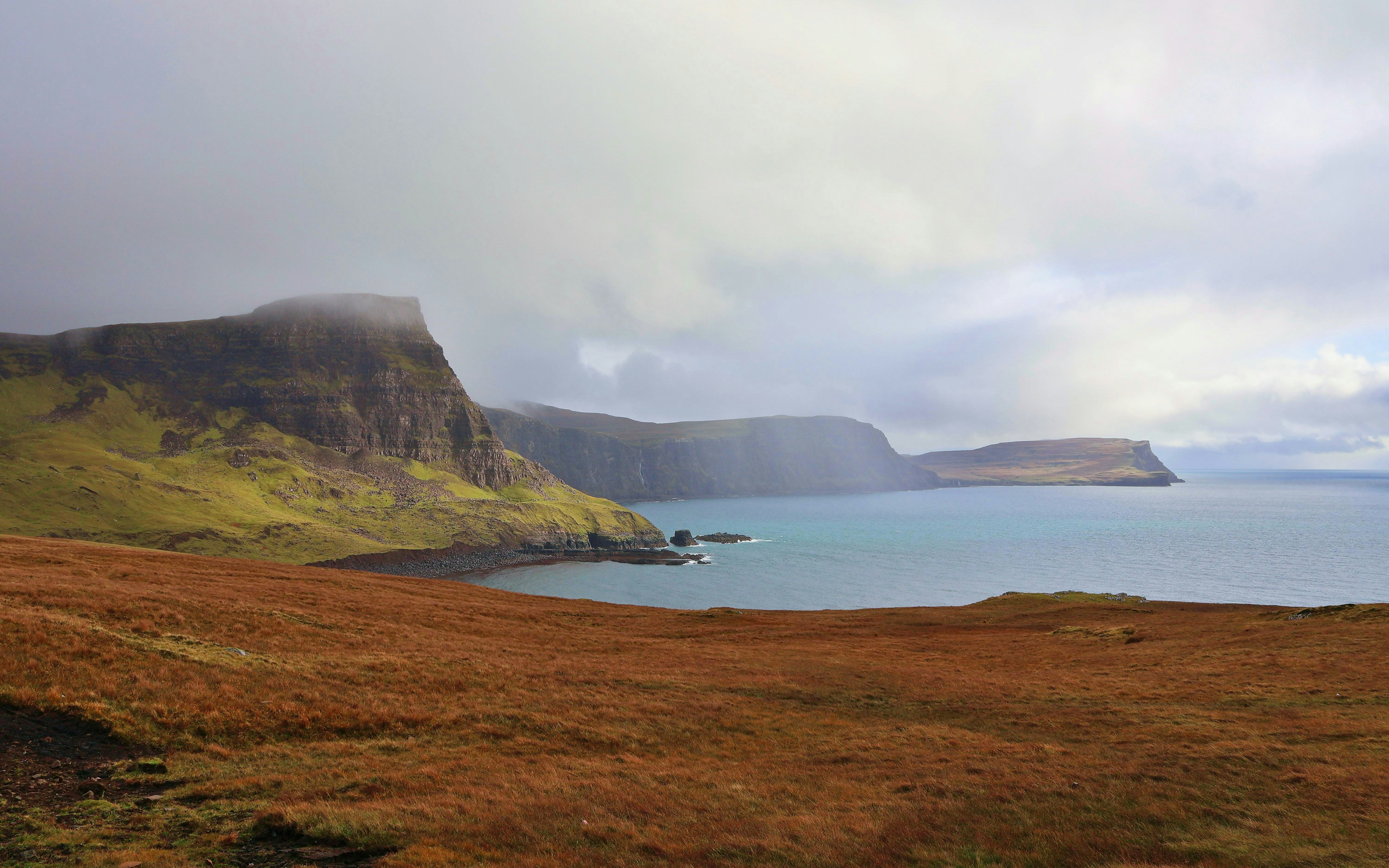 Trotternish Peninsula coastline with cliffs and sea view in Scotland.