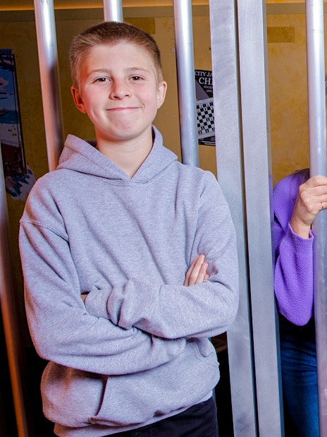 Visitors inside the jail cell at Monopoly Lifesized experience in London.
