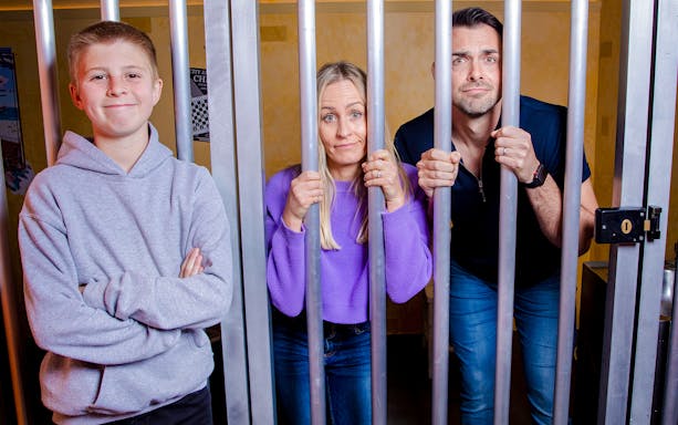 Jail cell at Monopoly Lifesized experience, London with game elements and interactive props.