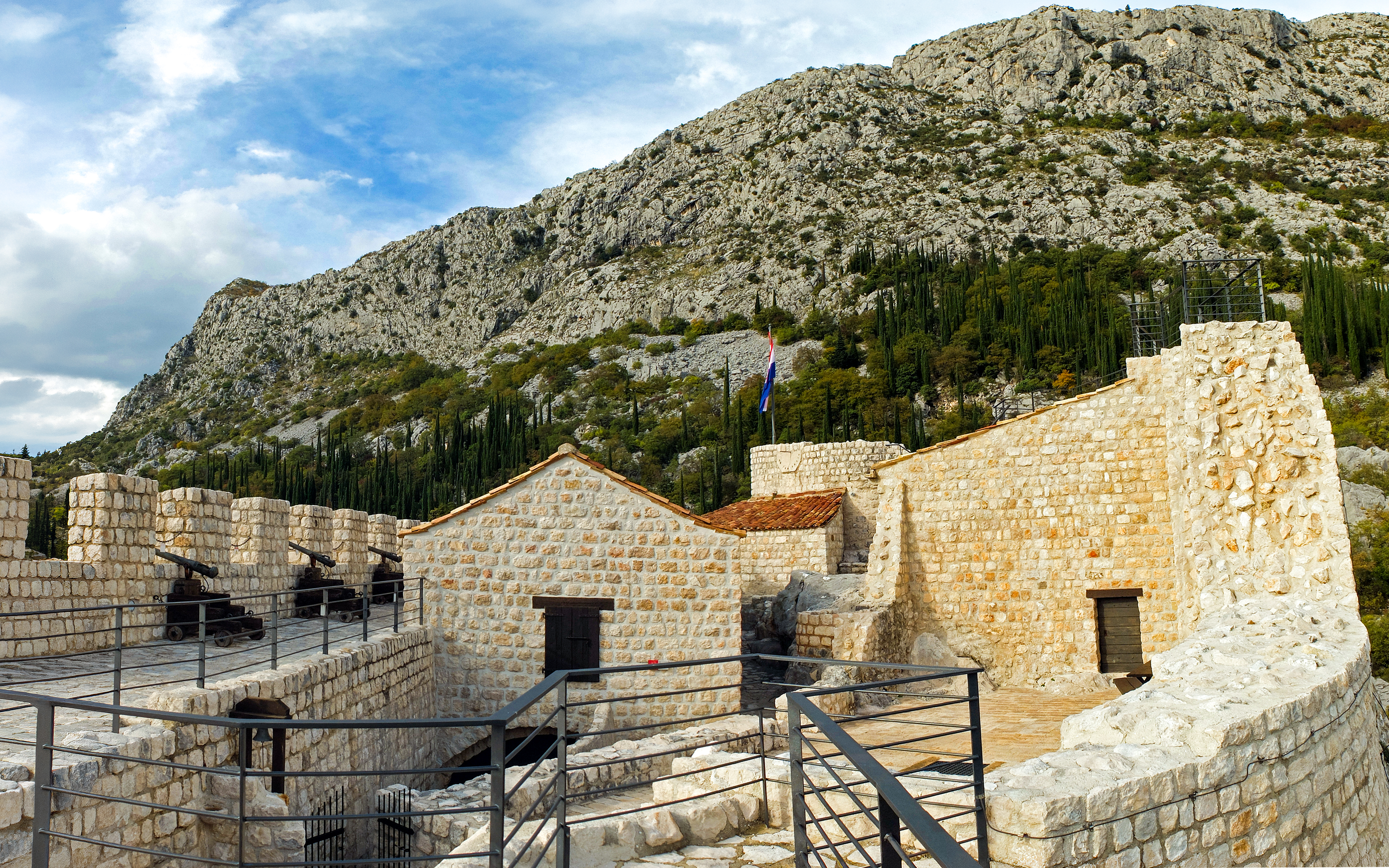 Sokol Grad castle fortress with stone walls and cannons in Croatia.