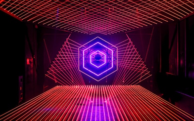 Neon light installation at Amaze Amsterdam with geometric patterns.