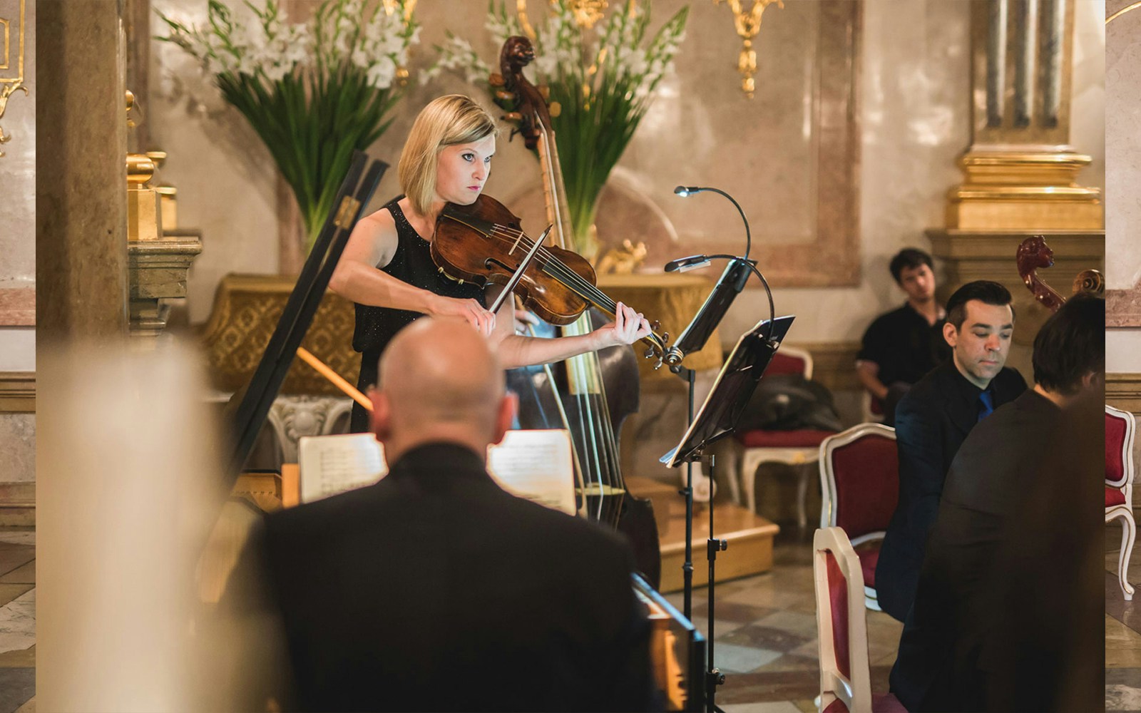 Mirabell Palace concert hall with musicians performing classical music, Salzburg.