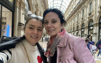 Two people inside Galleria Vittorio Emanuele II, Milan, during a self-guided city exploration game.