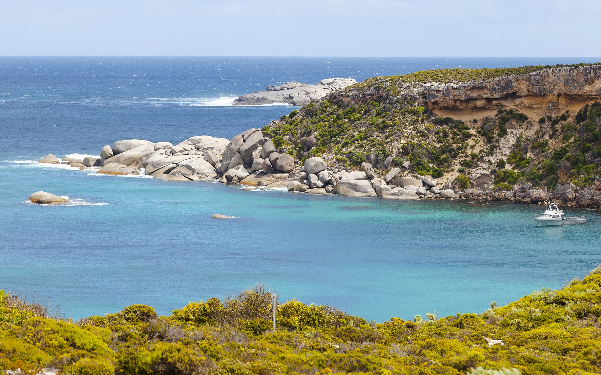 Panoramic view of Kangaroo Island coastline with rocky cliffs and turquoise waters.