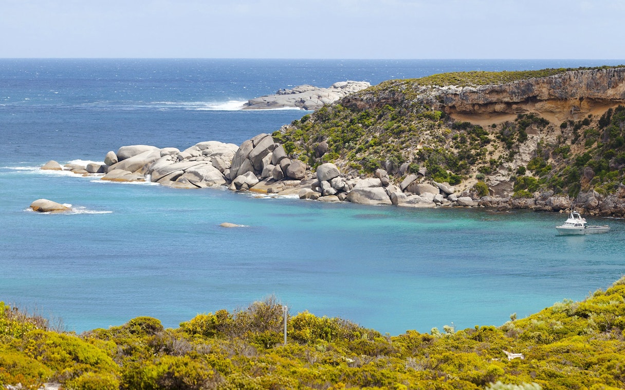 Panoramic view of Kangaroo Island coastline with rocky cliffs and turquoise waters.