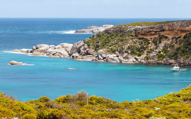Panoramic view of Kangaroo Island coastline with rocky cliffs and turquoise waters.
