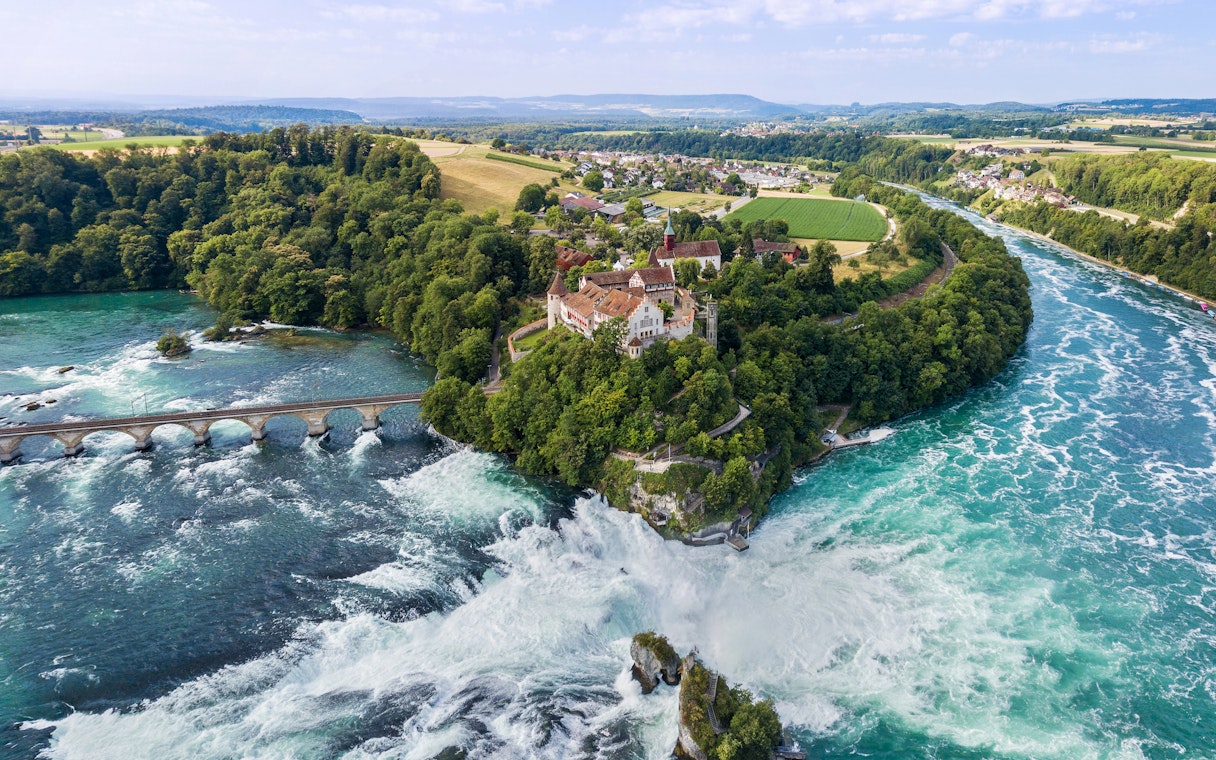 Aerial view of Schloss Laufen Castle overlooking Rhine Falls in Switzerland.