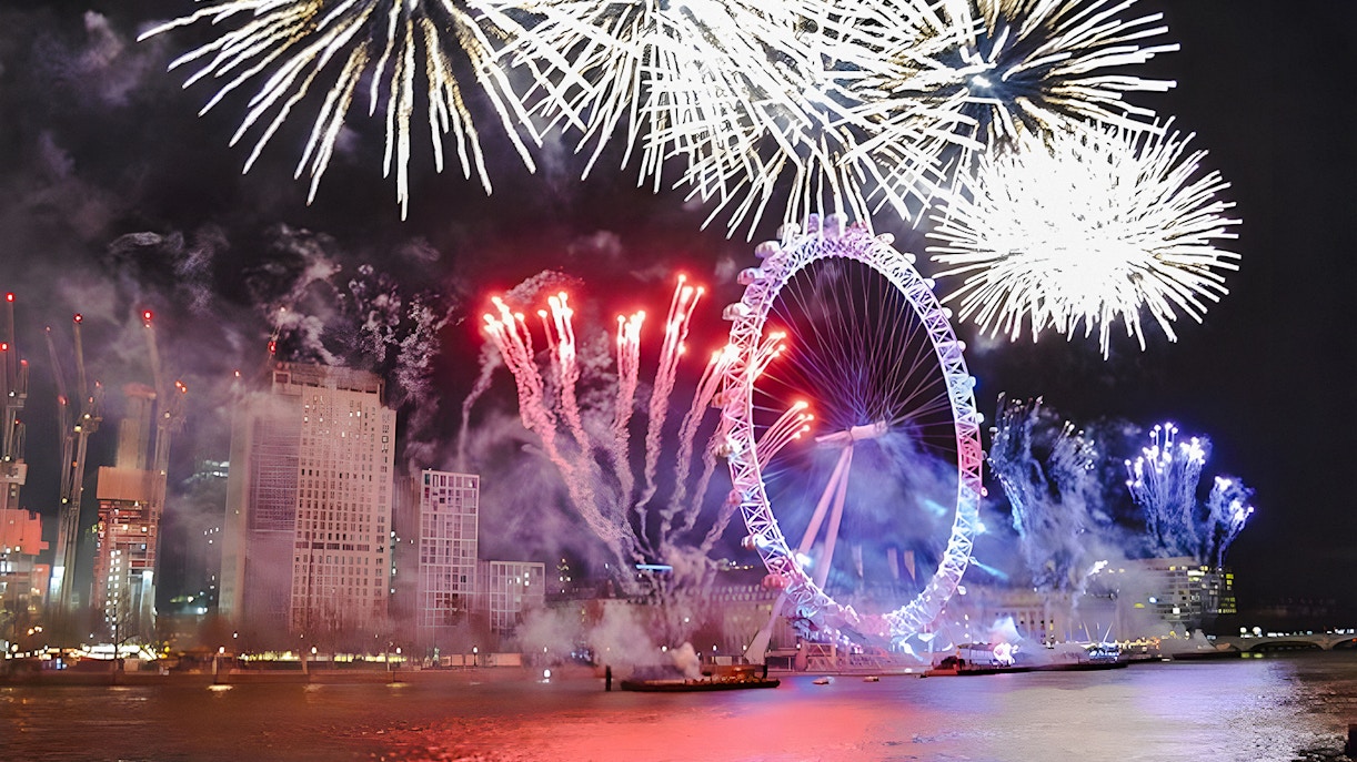 Fireworks over the London Eye on New Year's Eve, River Thames, London.