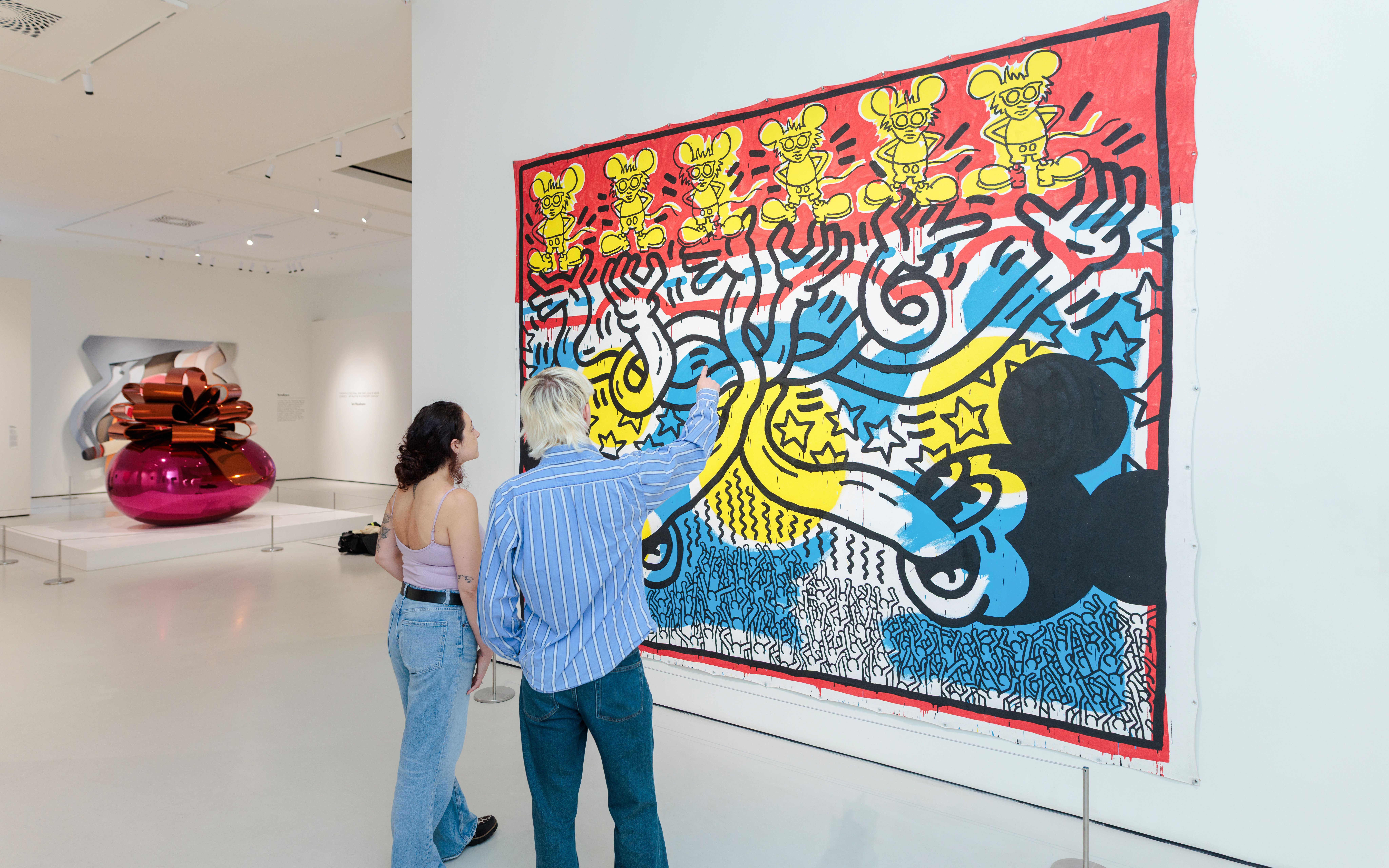 Guests viewing colorful pop art at Moco Museum London.