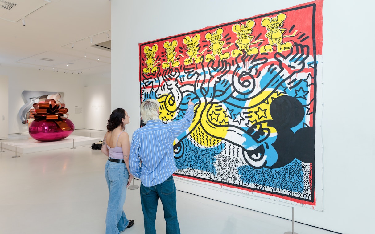 Guests viewing colorful pop art at Moco Museum London.