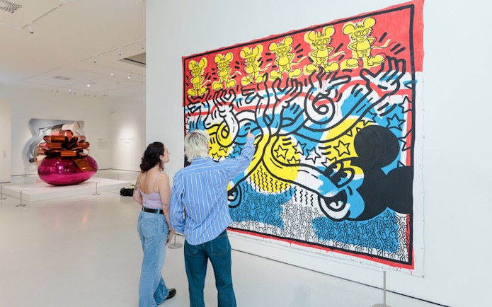 Guests viewing colorful pop art at Moco Museum London.