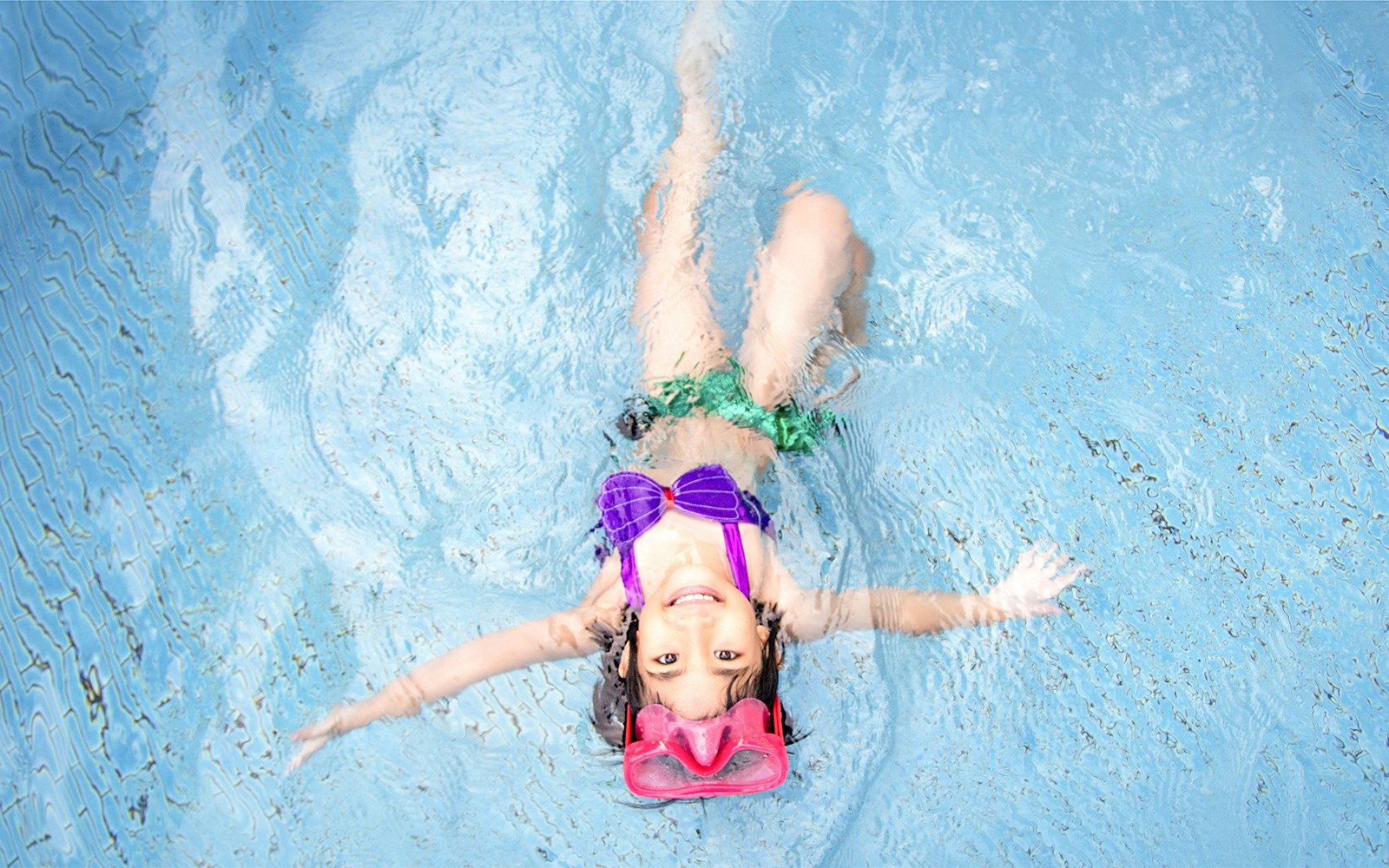 Child enjoying a swim at Wild Wild Wet water park.