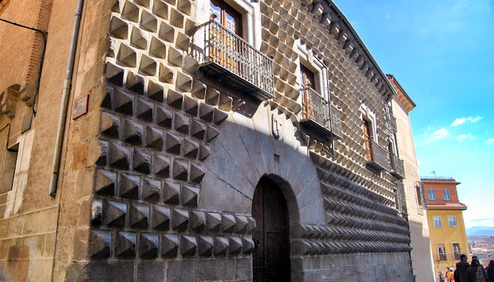 Facade of Casa de los Picos with unique diamond-shaped stonework in Segovia, near Royal Palace of La Granja.