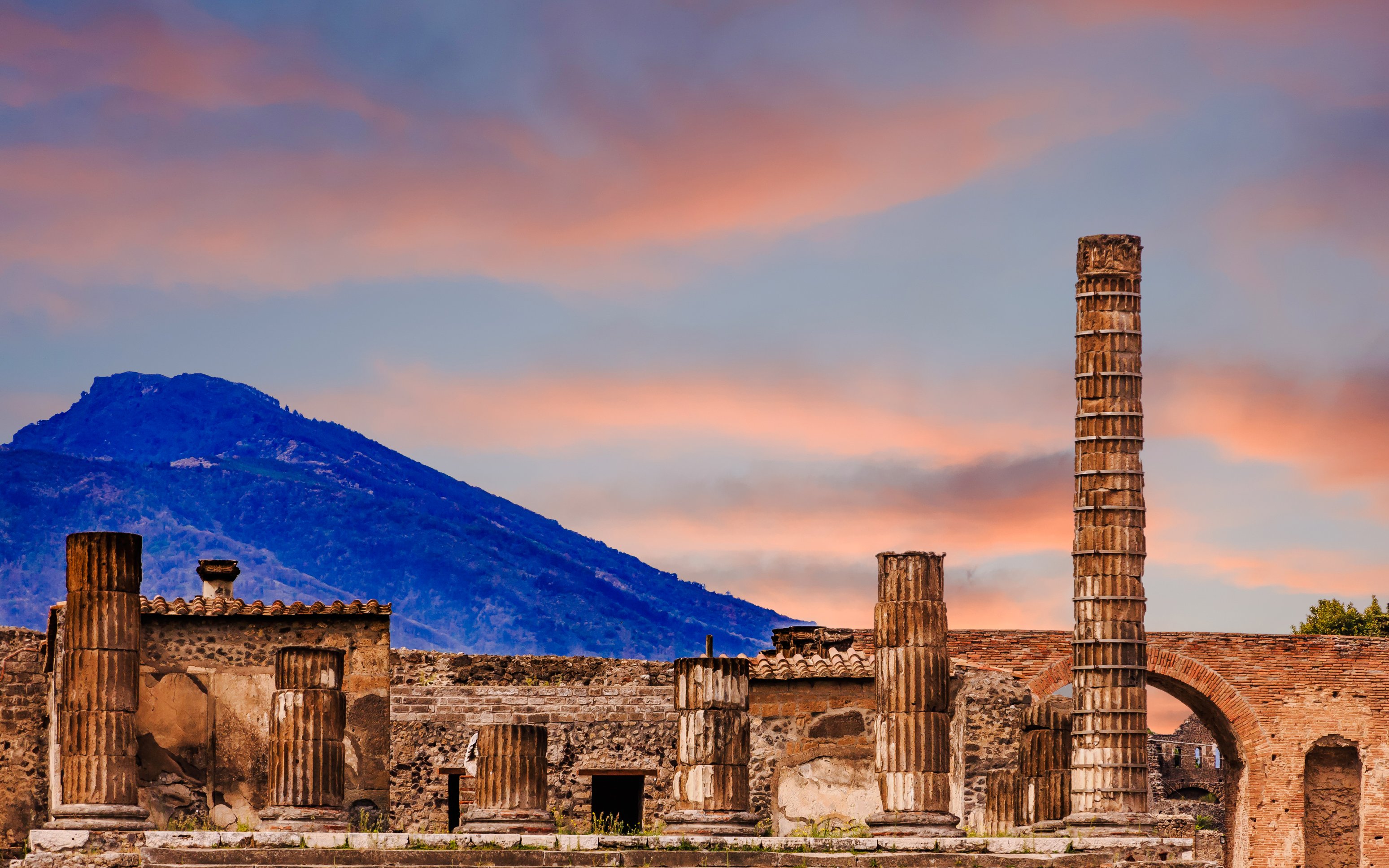 Ruins of the Basilica with Mount Vesuvius in the background, Pompeii, Italy.