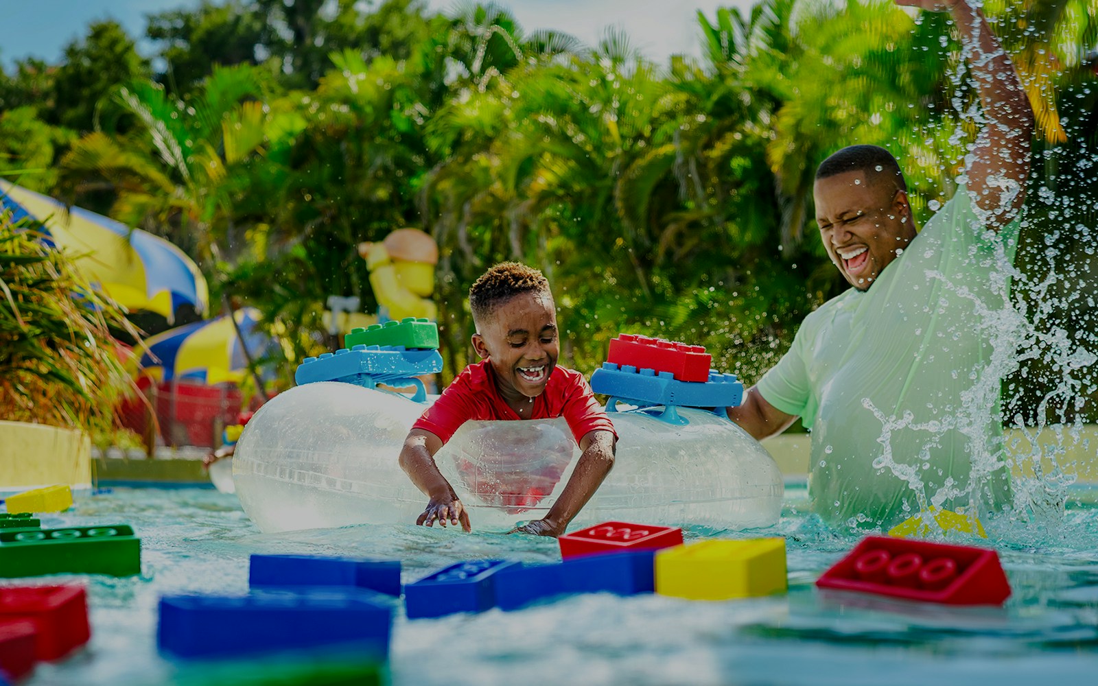 Child enjoying Lazy River with floating LEGO bricks at Legoland Florida Water Park.