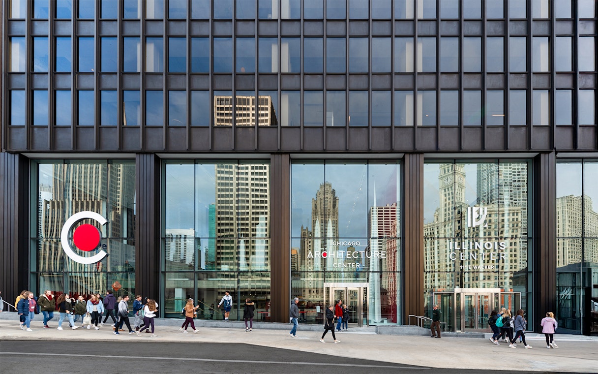 Exterior facade of the Chicago Architecture Center with people walking by.