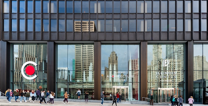 Exterior facade of the Chicago Architecture Center with people walking by.