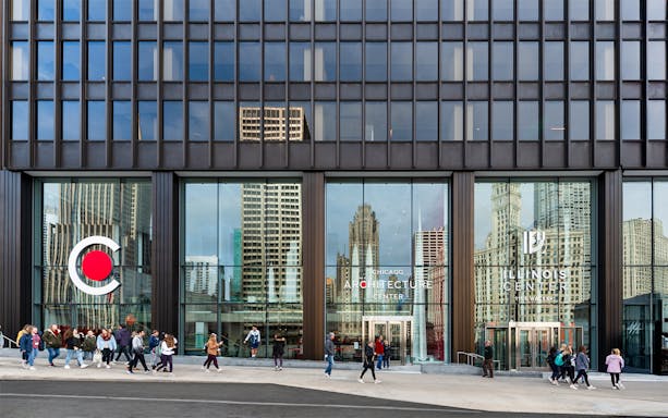 Exterior facade of the Chicago Architecture Center with people walking by.