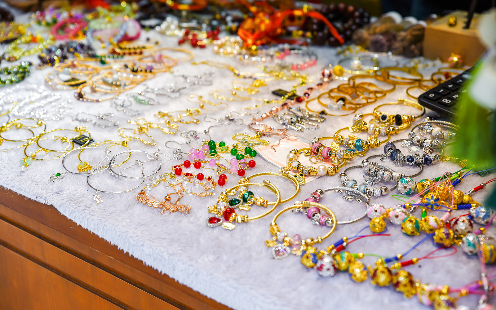 Handcrafted jewelry display at Monti Urban Market, Rome.