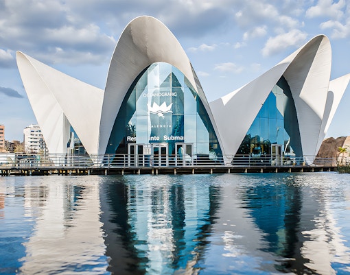 Oceanogràfic oceanarium building with unique architecture in Valencia, Spain reflected in water.