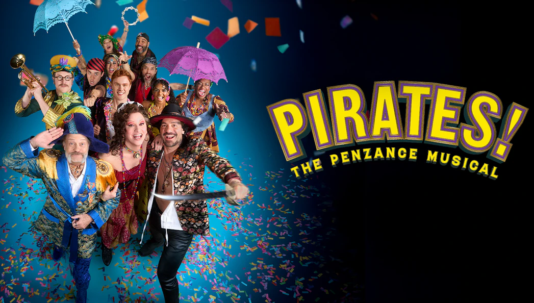 Cast of Pirates! The Penzance Musical in colorful costumes with confetti and props.