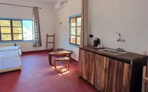 Rustic room with wooden furniture and mountain view, Amizmiz Hiking Day, Marrakesh.