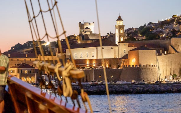 Dubrovnik old town view from Karaka Ship during sunset cruise.