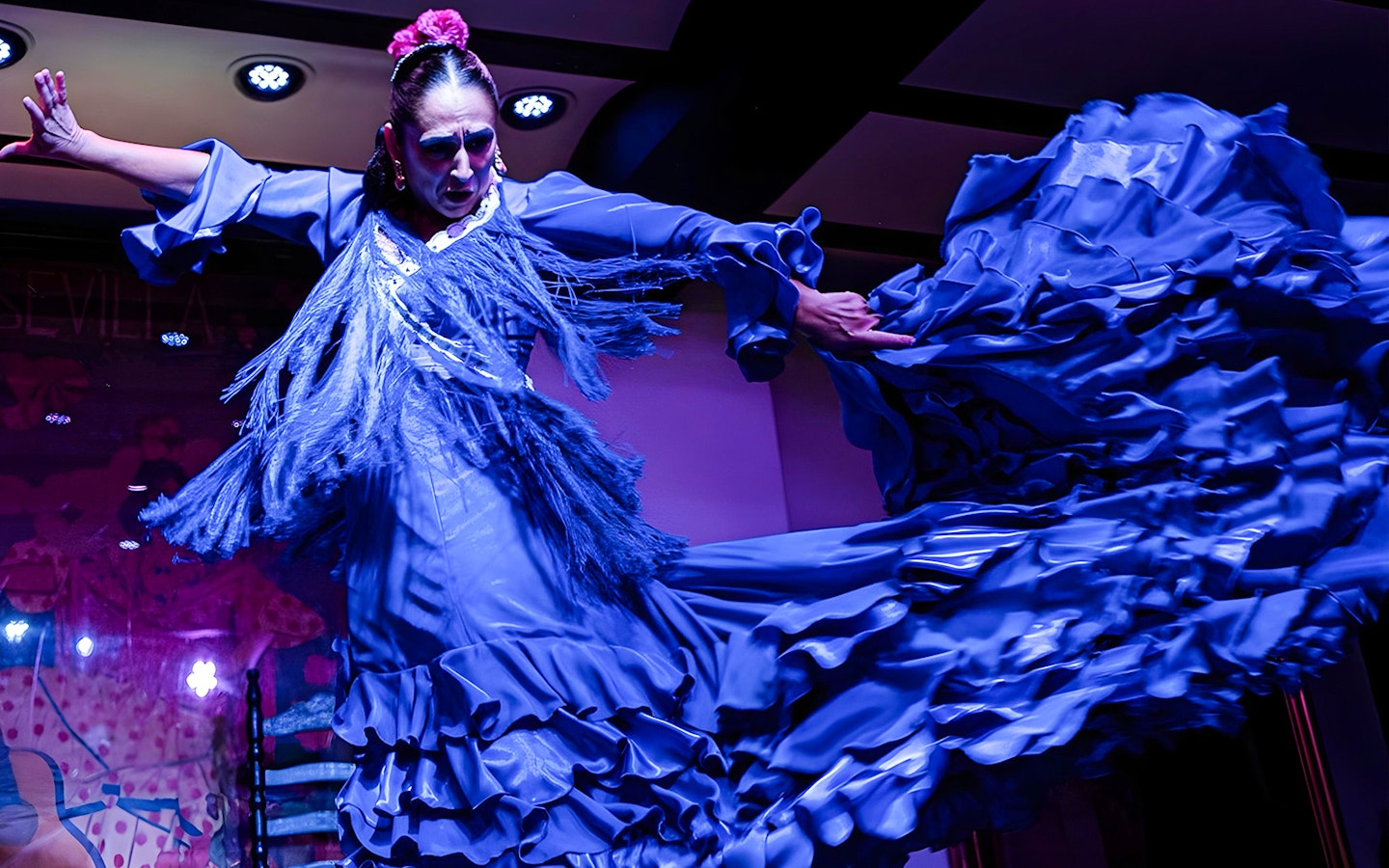 Flamenco dancer performing at Tablao El Arenal in Seville, Spain.