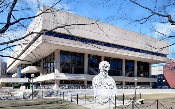 Stratton Student Center in Cambridge, Boston with sculpture and bicycles in front.