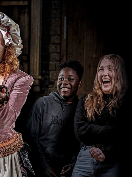 Mrs Lovett presenting a pie to amused visitors at London Dungeon.