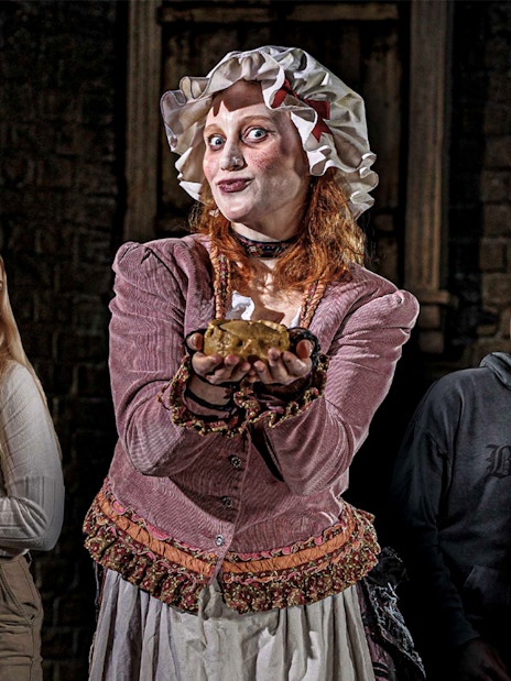 Mrs Lovett presenting a pie to amused visitors at London Dungeon.