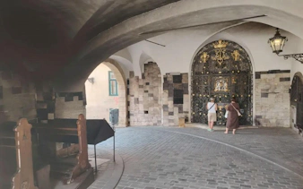 Stone archway with ornate gate in Zagreb, part of the Slavic Myths Easy Walk self-guided city exploration game.