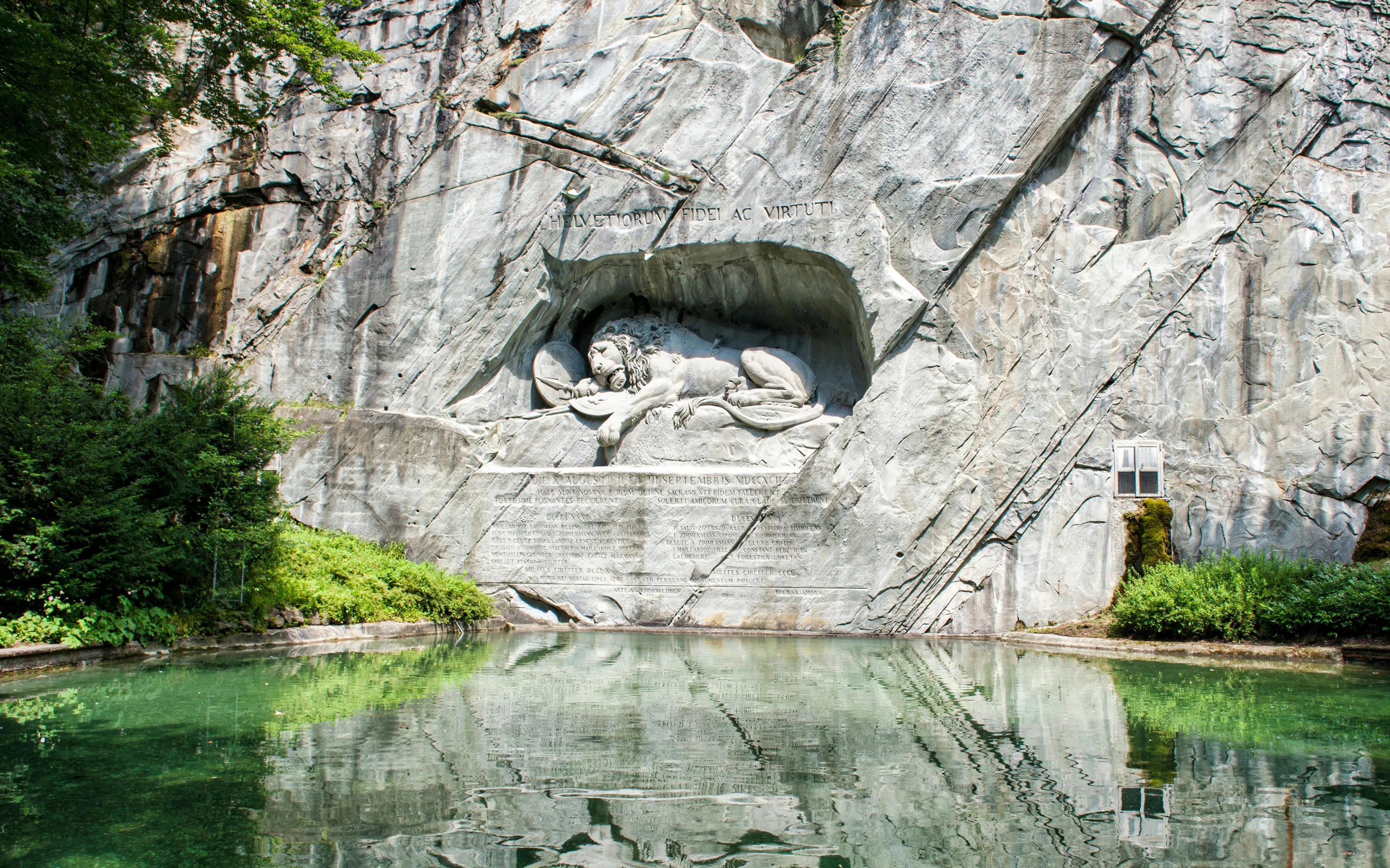 Close-up of the Lion Monument, a dying lion carved into a rock face in Lucerne, Switzerland.