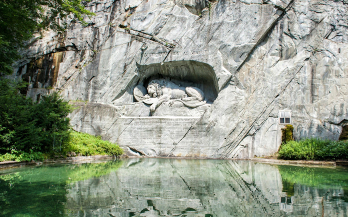 Close-up of the Lion Monument, a dying lion carved into a rock face in Lucerne, Switzerland.