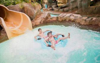 Children enjoying a water slide at Alton Towers Waterpark.