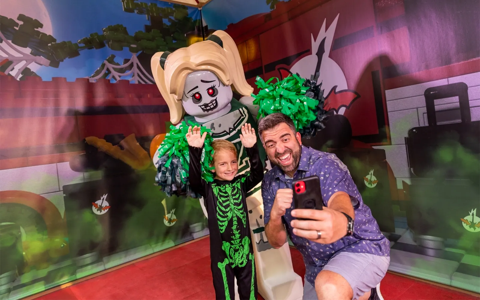 Guest taking selfie with Lego zombie at Brick or Treat, Legoland Florida.