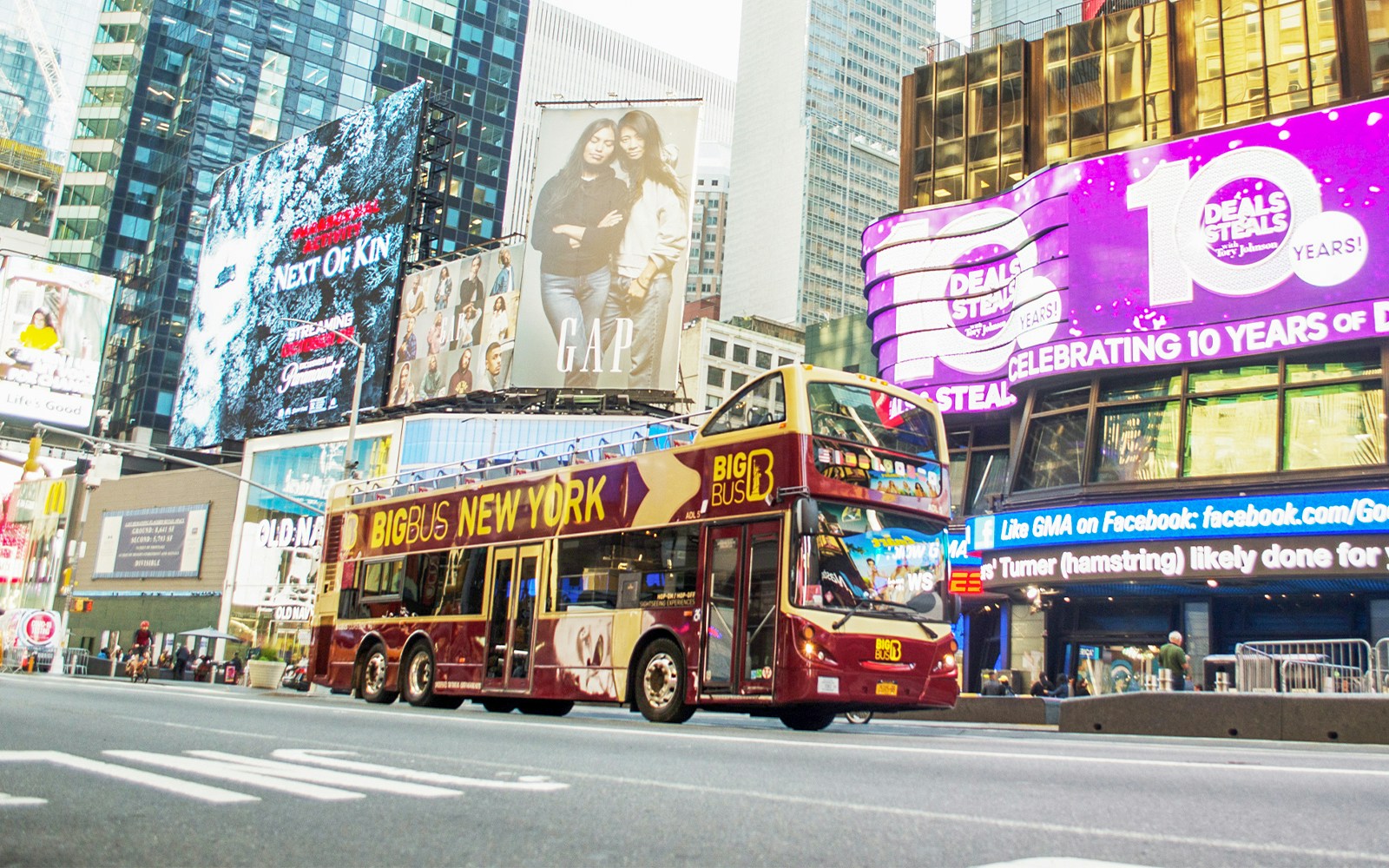 Tourists on Big Bus tour in New York passing by city landmarks