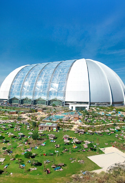 Tropical Islands Resort dome with outdoor pool and sunbathing area near Berlin.