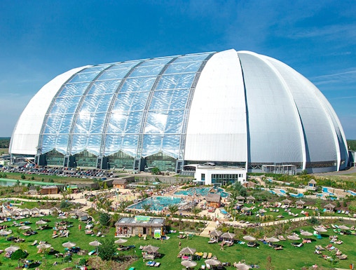 Tropical Islands Resort dome with outdoor pool and sunbathing area near Berlin.