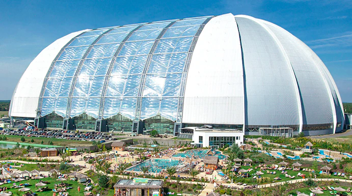 Tropical Islands Resort dome with outdoor pool and sunbathing area near Berlin.