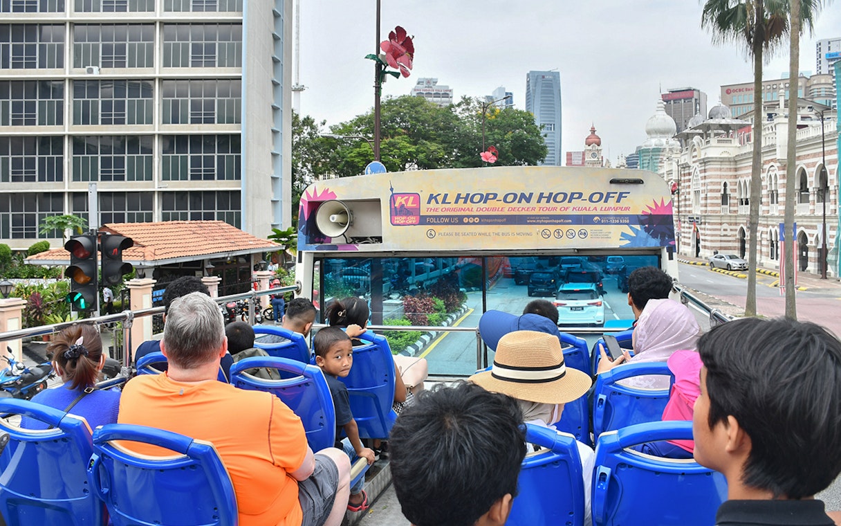 Passengers on a double-decker bus during the Hop-On Hop-Off Tour in Kuala Lumpur.