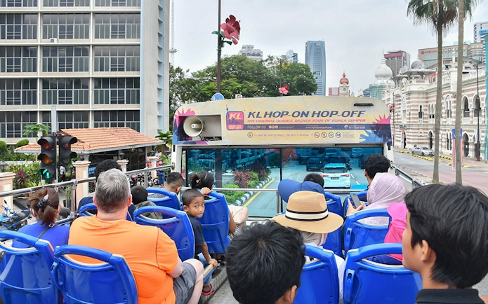 Passengers on a double-decker bus during the Hop-On Hop-Off Tour in Kuala Lumpur.